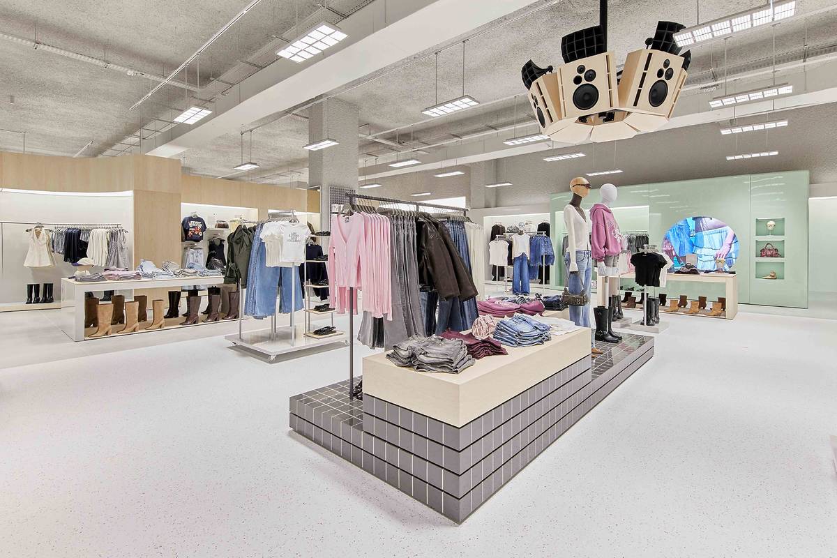 new bershka store in trafford centre, greater manchester with clothes rails, blocks and overhead sound system