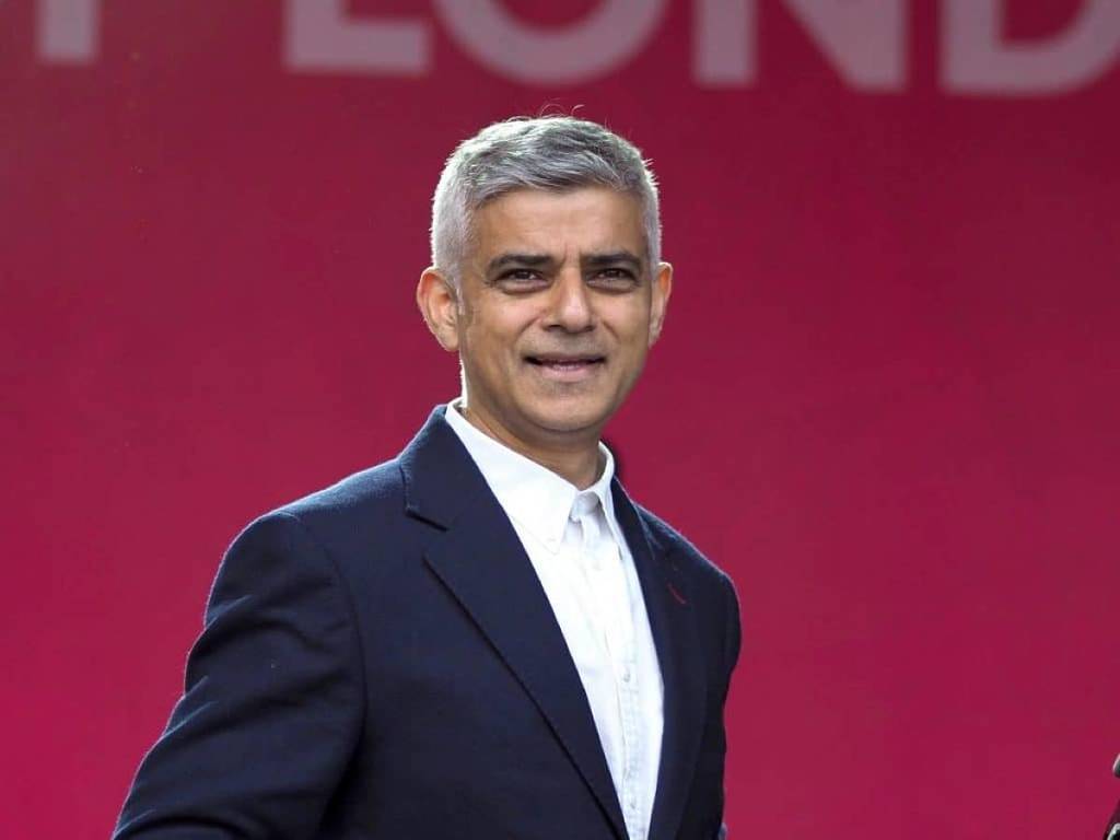 sadiq khan in front of red background mayor of london uk vote