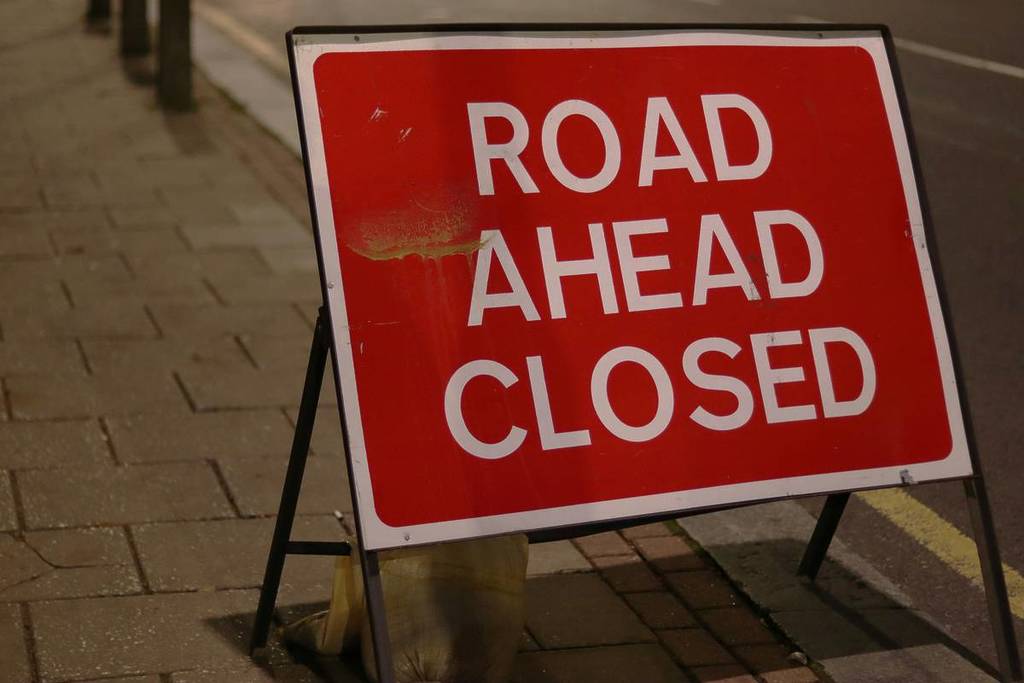 road ahead closed sign mancunian way
