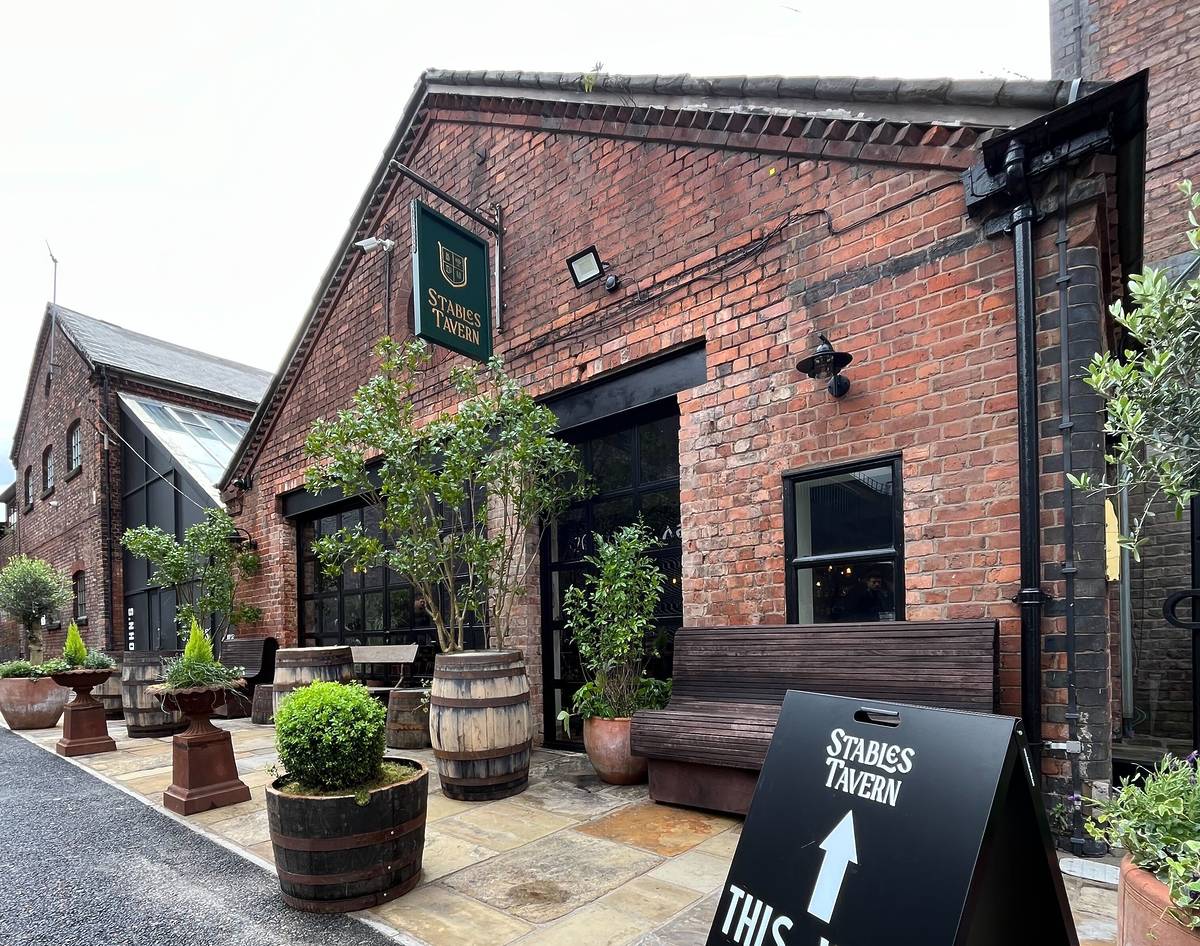 outside former site of rovers return which has been upgraded to become stables tavern pub in manchester