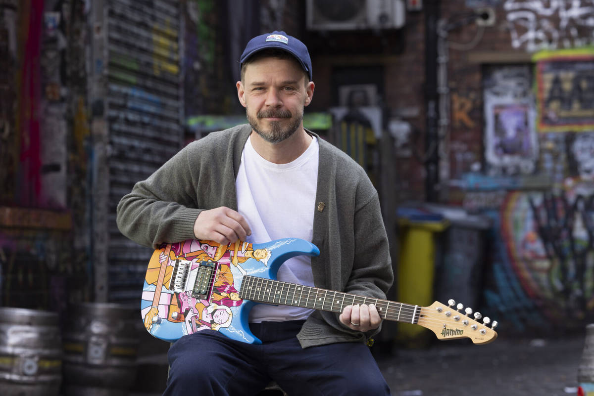 artist hammo holding guitar as part of music for the sense mcr live 25
