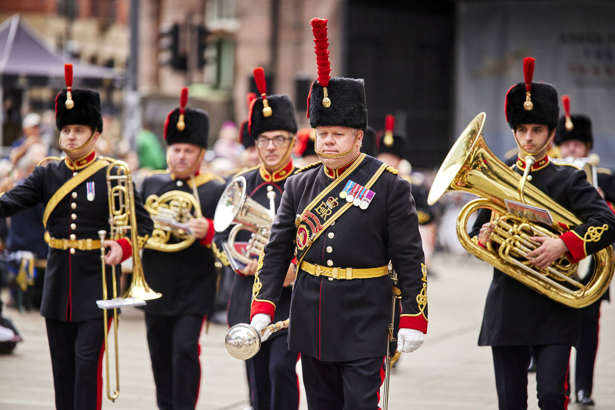 armed forces day parade through manchester with artillery band