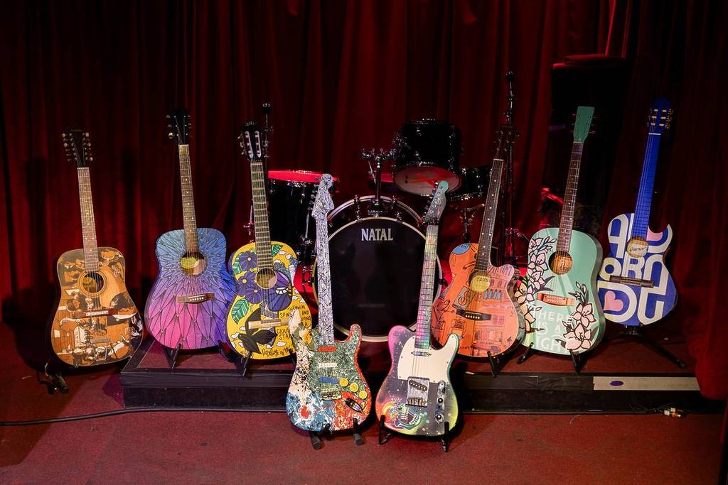 decorated guitars displayed for music for the senses art trail manchester