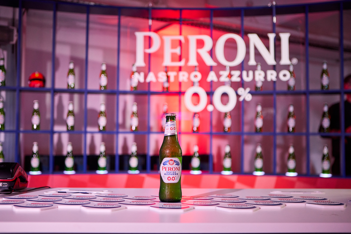 peroni nastro azzurro 0.0% beer in front of the logo