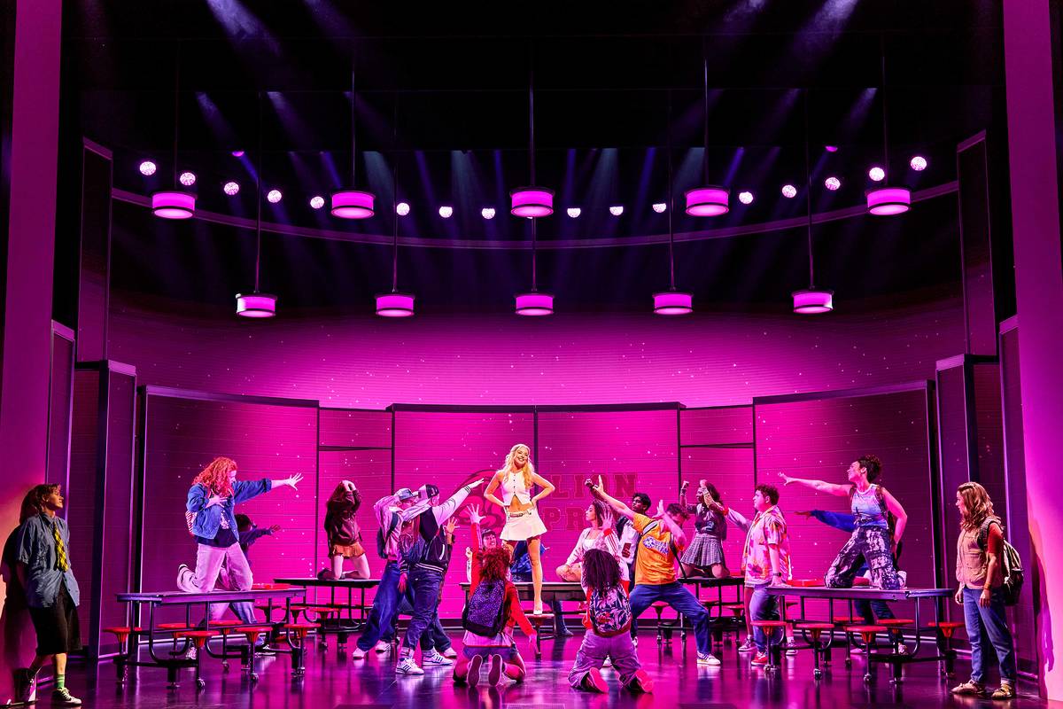ensemble on stage with pink lighting at mean girls the musical