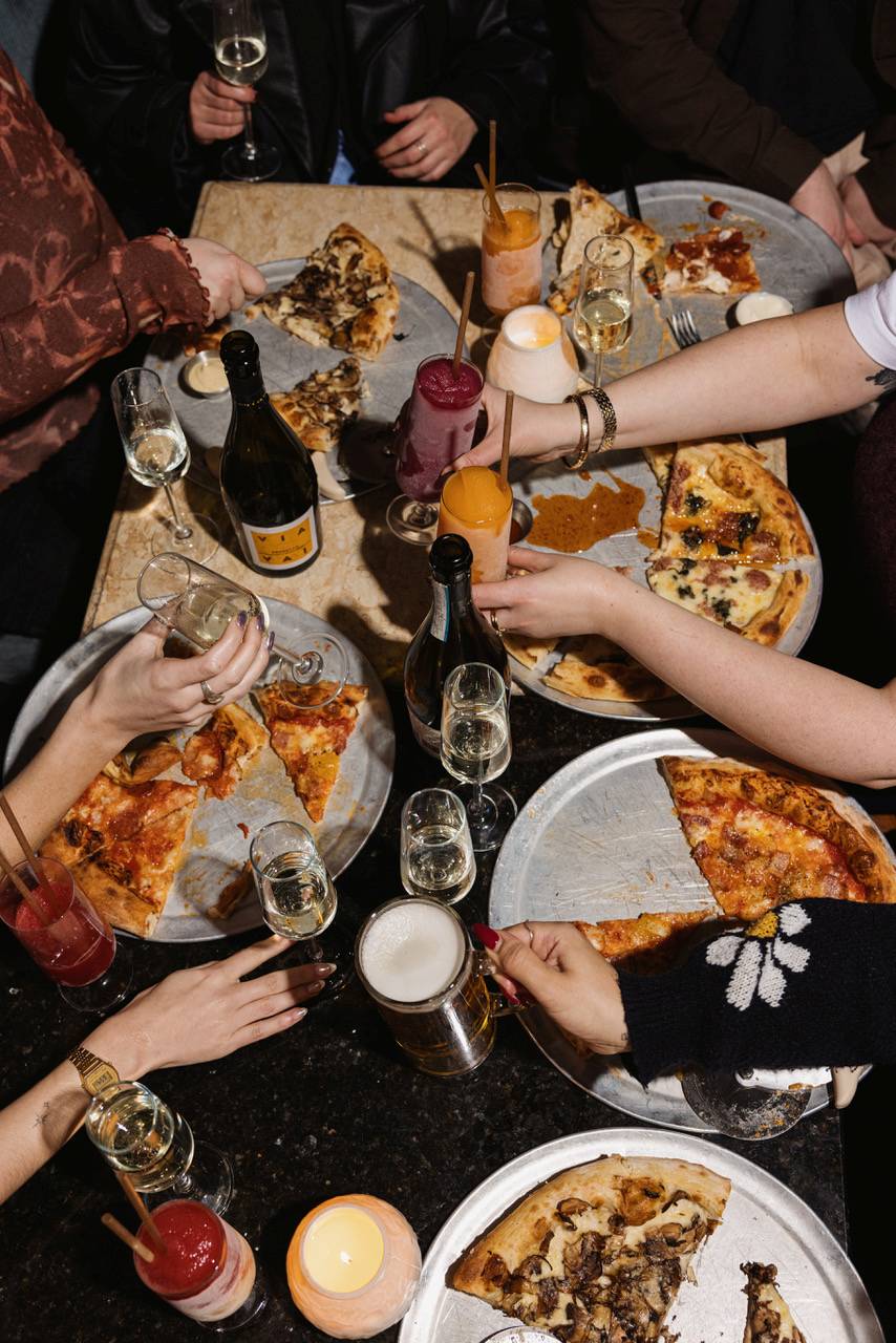 diecast food and drink on table part of bottomless brunch including frozen daquiris and pizza slices