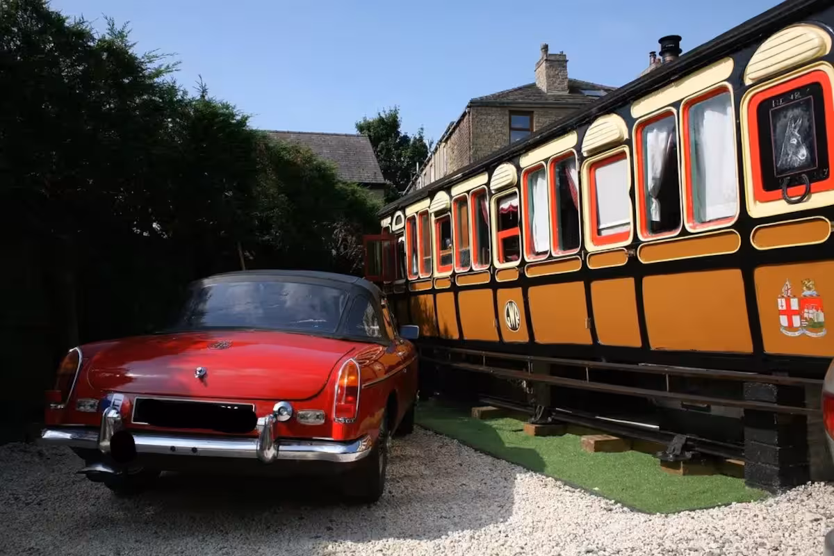train carriage exterior airbnb delph with vintage car