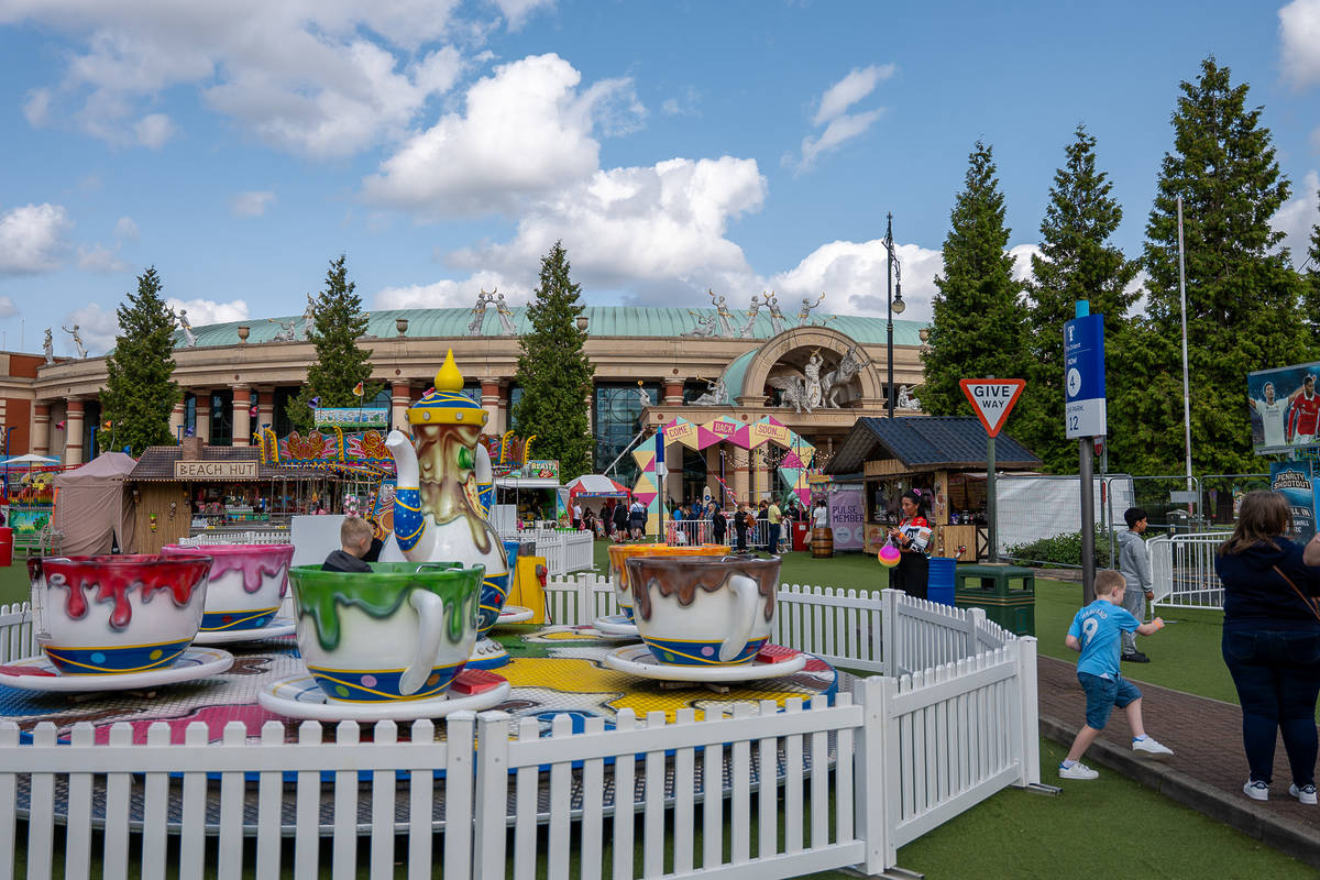 teacup rides outside the great hall at the trafford centre summer fair