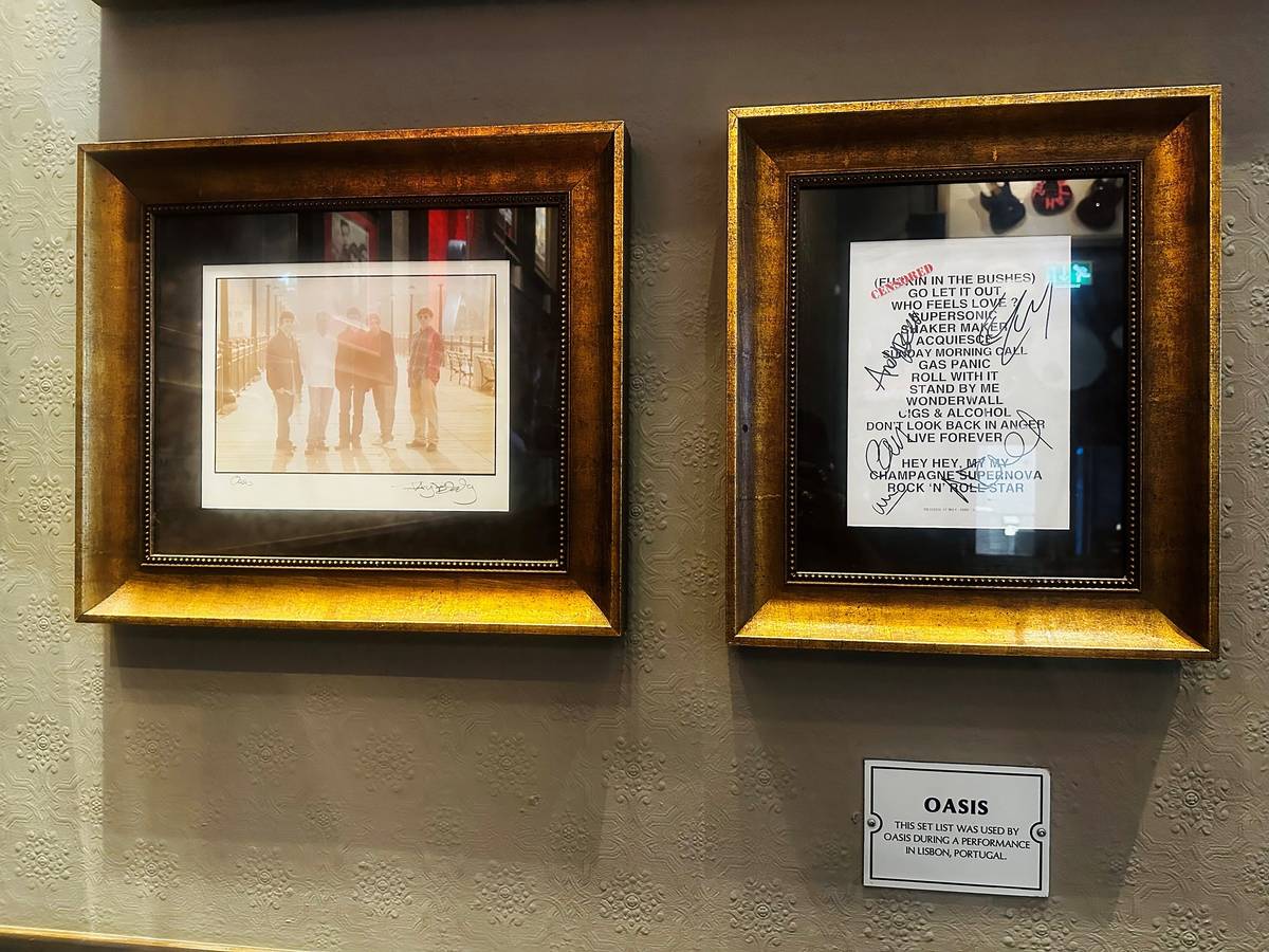 framed lyrics and photo on wall