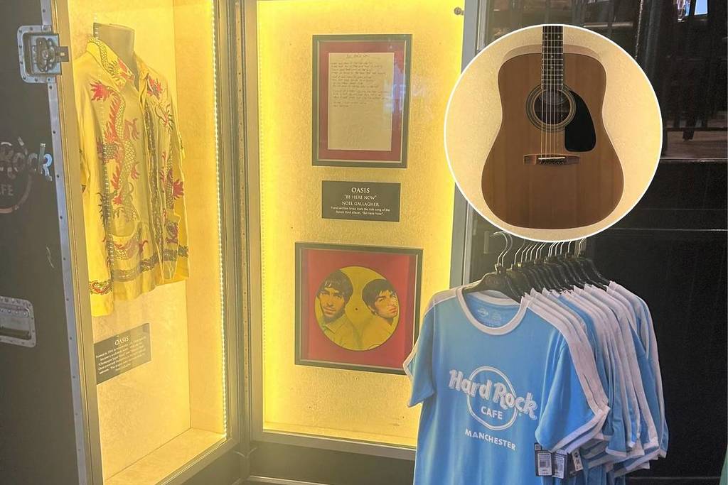 hard rock cafe manchester oasis memorabilia close up on acoustic guitar
