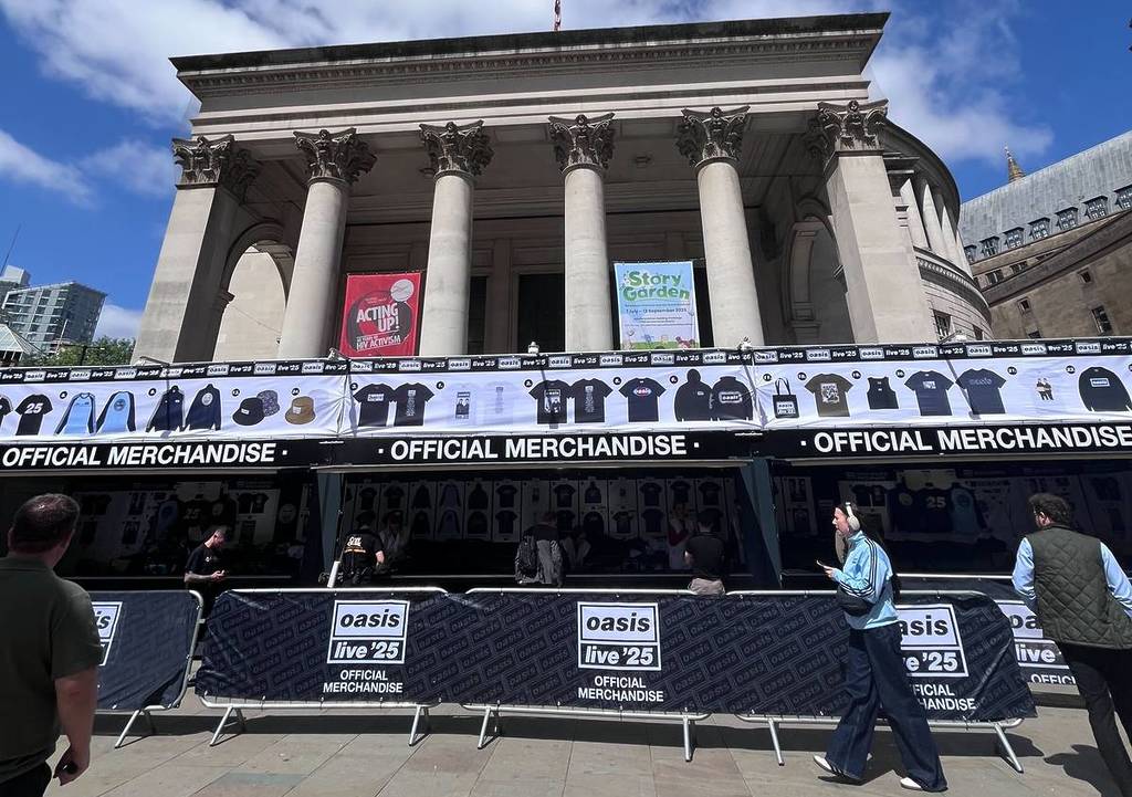 oasis live touring stand merch in front of central library manchester