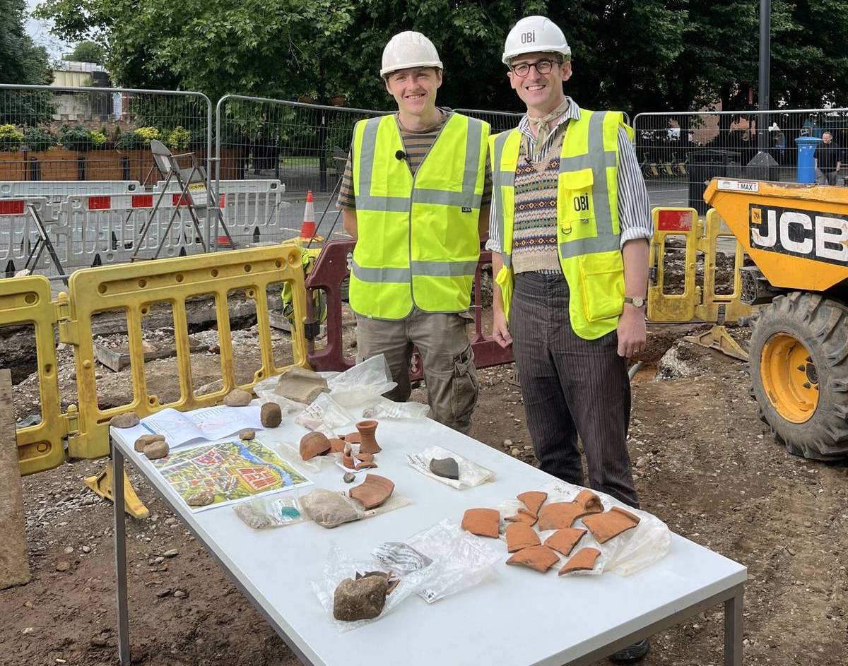 civic archaeologists with roman remains on table in manchester