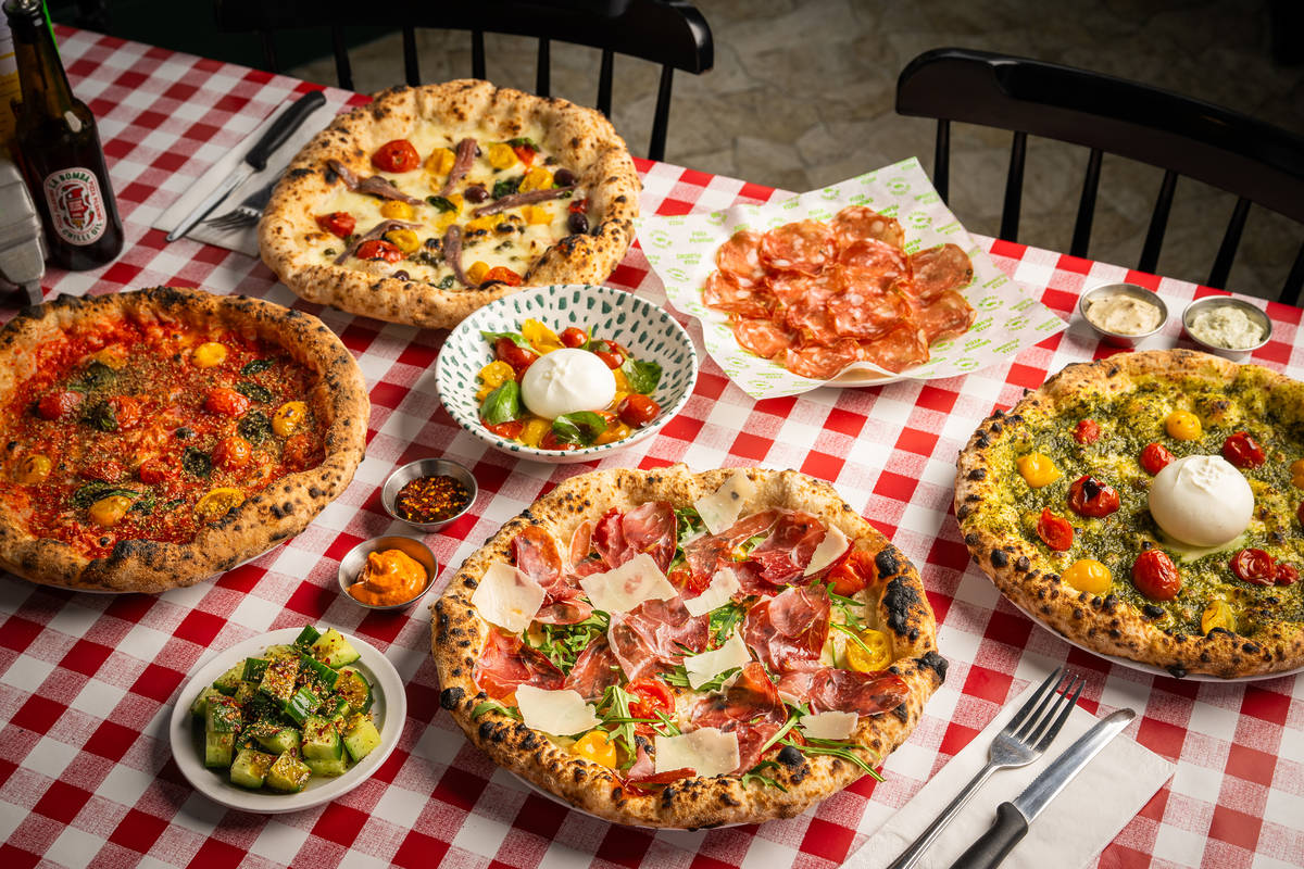 new dishes on pizza pilgrims spring menu - three pizzas, salami, salad, dips and bites