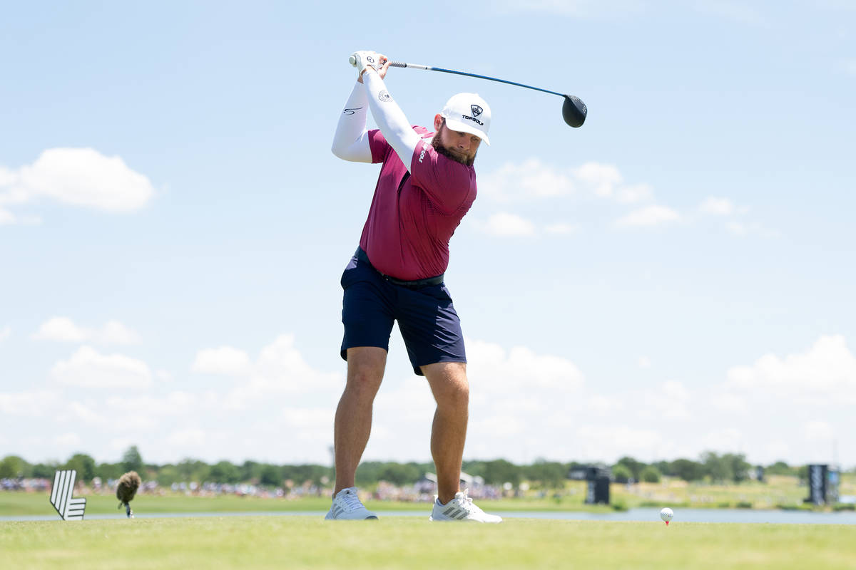 a golf Player swings his club at LIV Golf