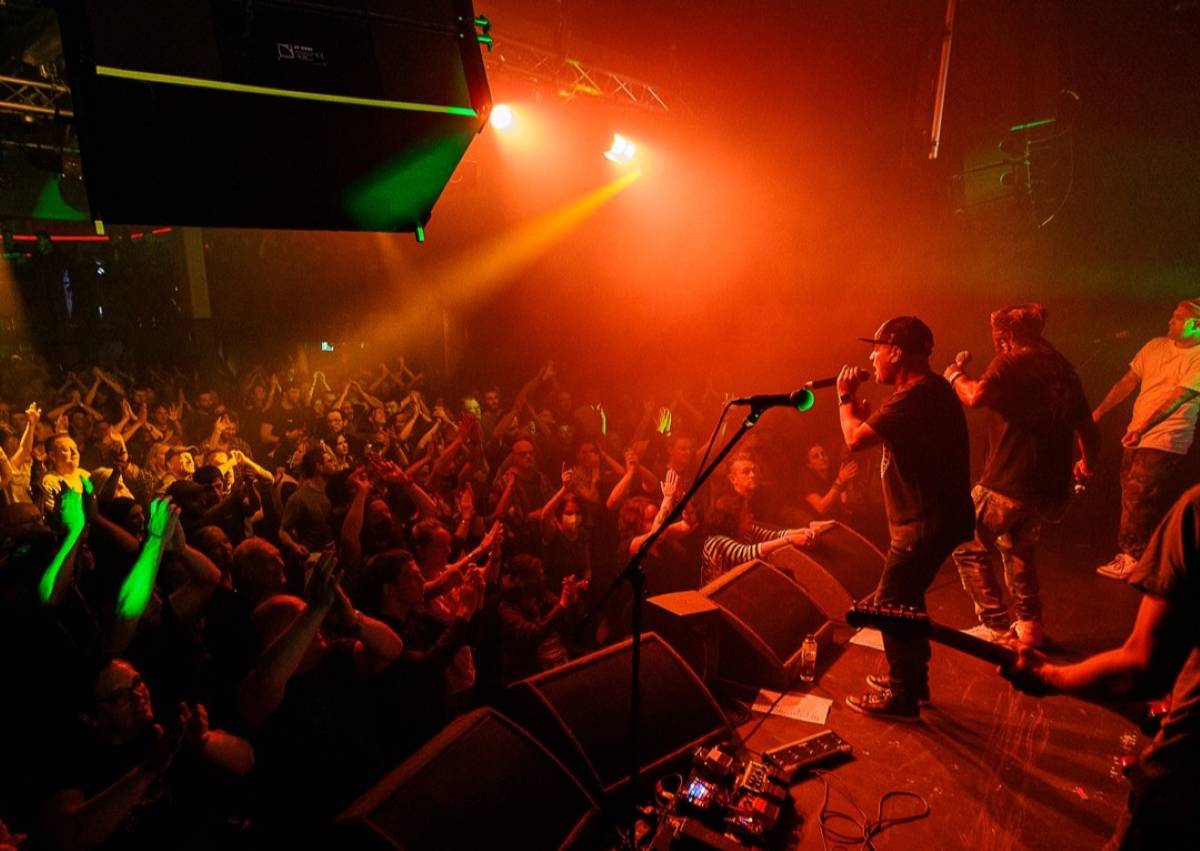 band on the wall performing on stage red lights manchester best independent venues