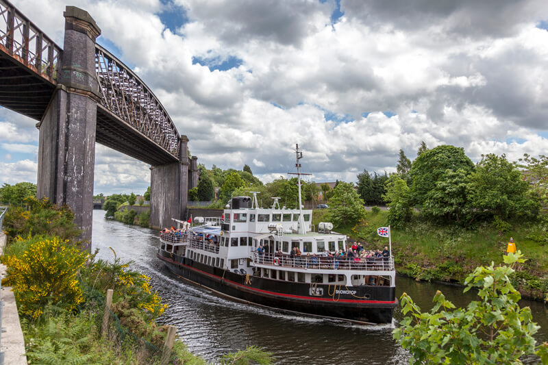 ferry on manchester ship canal under bridge