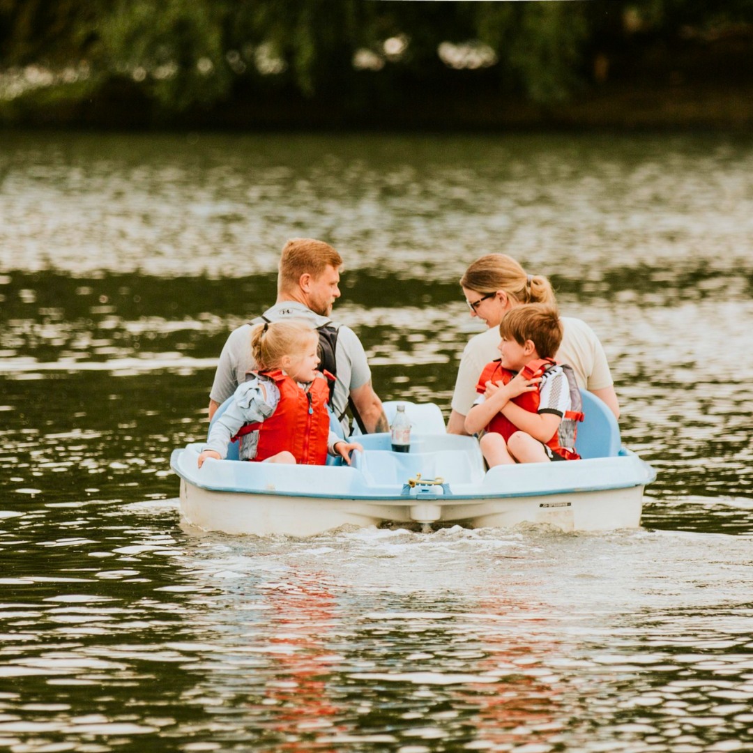 family on paddle boats