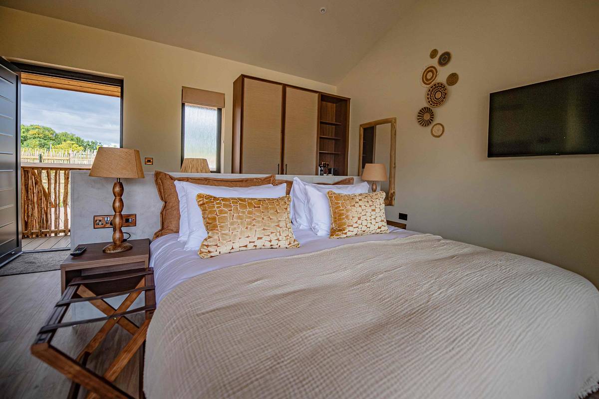 bedroom inside lodge at the reserve, chester zoo