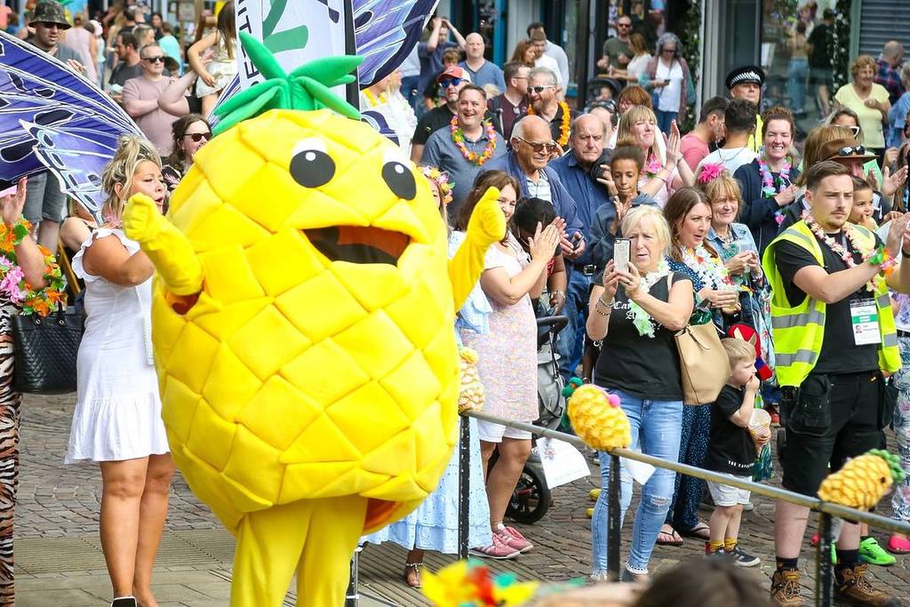 big pineapple in street at pina colada festival in northwich