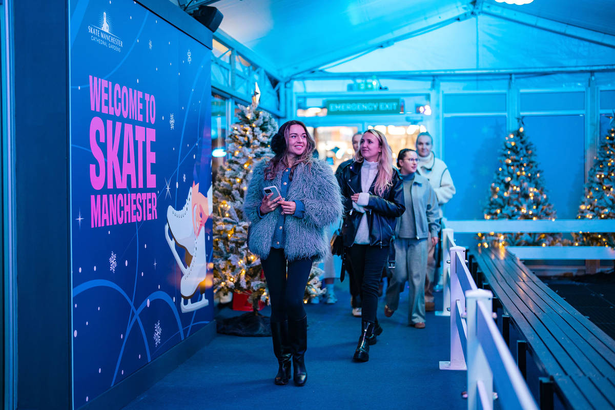 people walking through the entrance of skate manchester