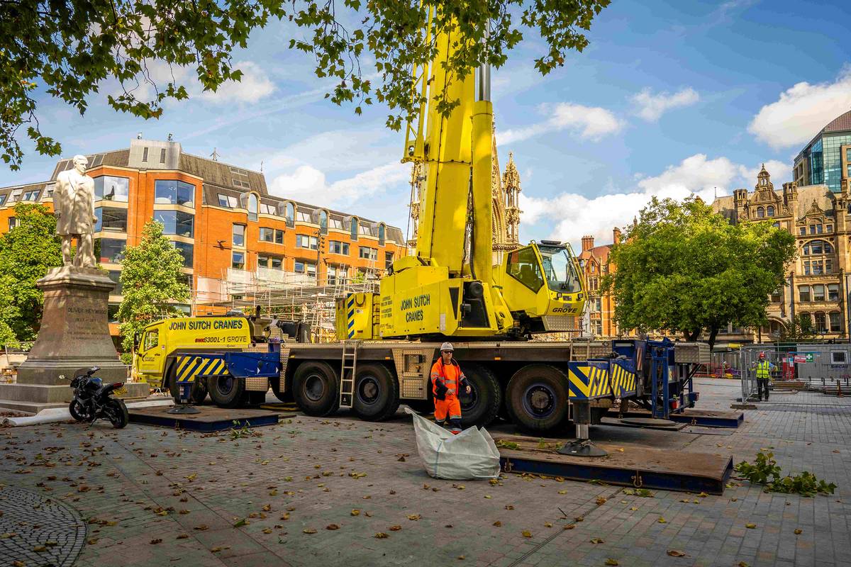 yellow crane on albert square outside manchester town hall