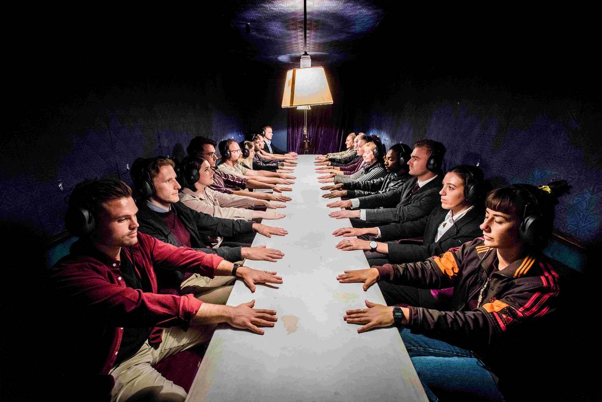 people with hands in the middle at séance experience by darkfield