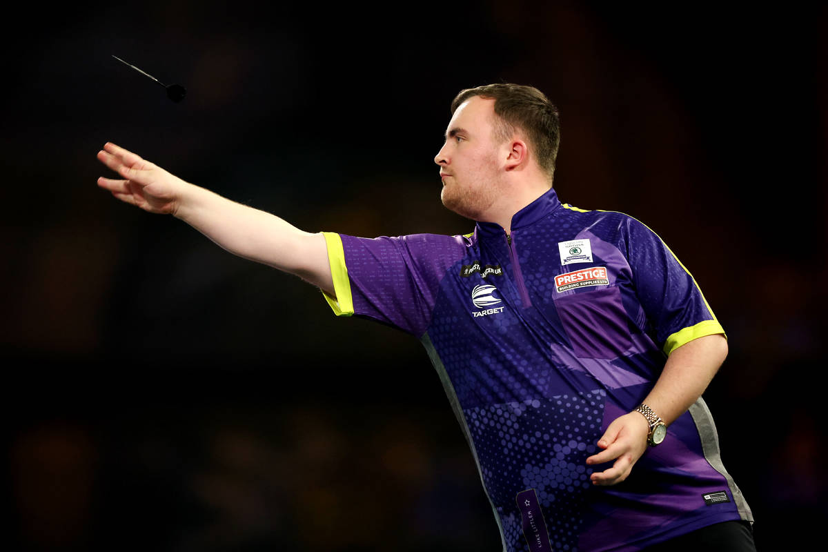 Luke Littler throws during his round 1 match against Christian Kist on day 6 of the 2023/24 Paddy Power World Darts Championship at Alexandra Palace on December 20, 2023 in London, England.