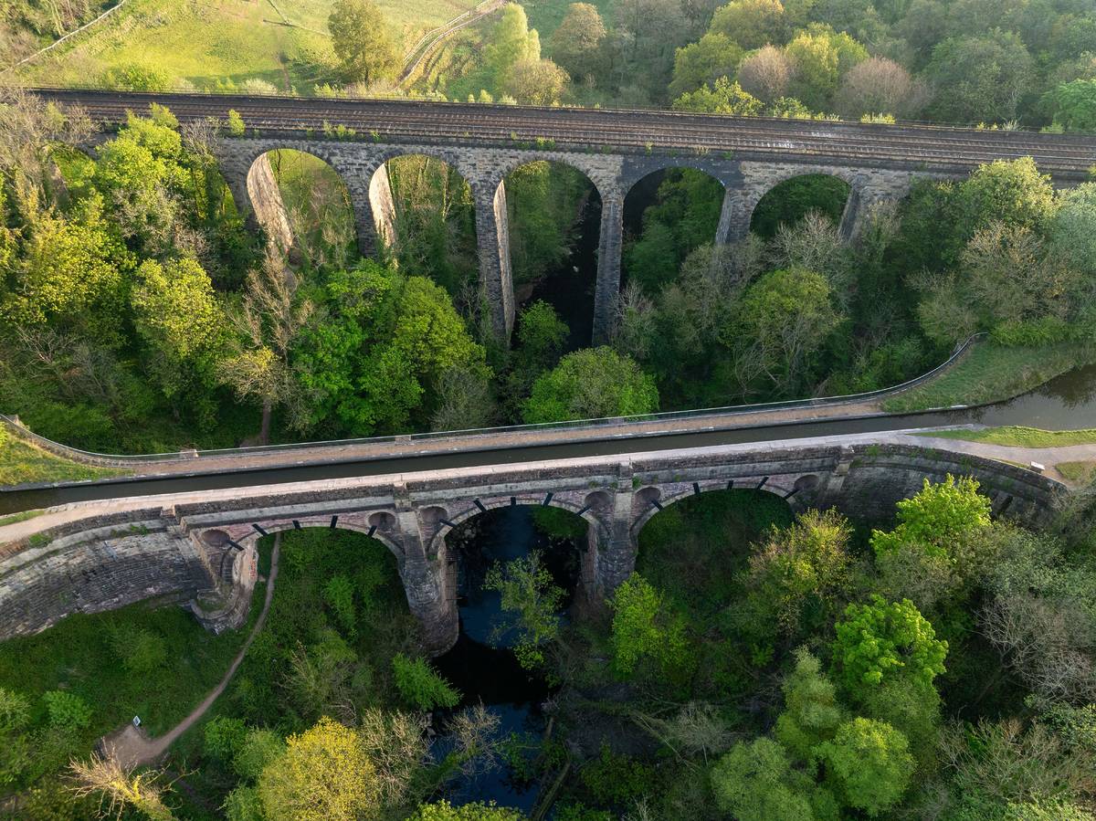 Aerial image of Marple Viaduct and Aqueduct with a beautiful landscape view at sunrise. Greater Manchester - UK