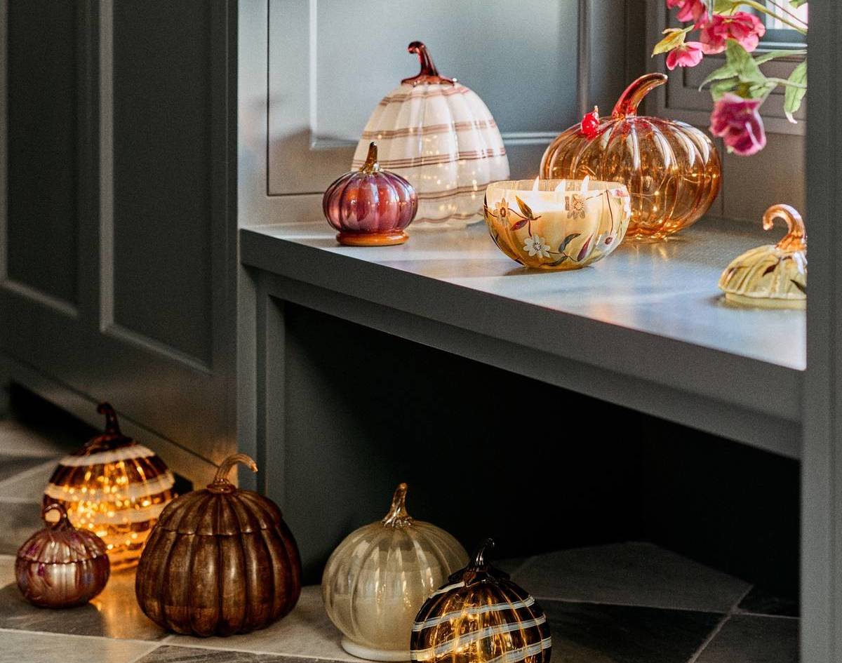 anthropologie glass pumpkins on floor and windowsill
