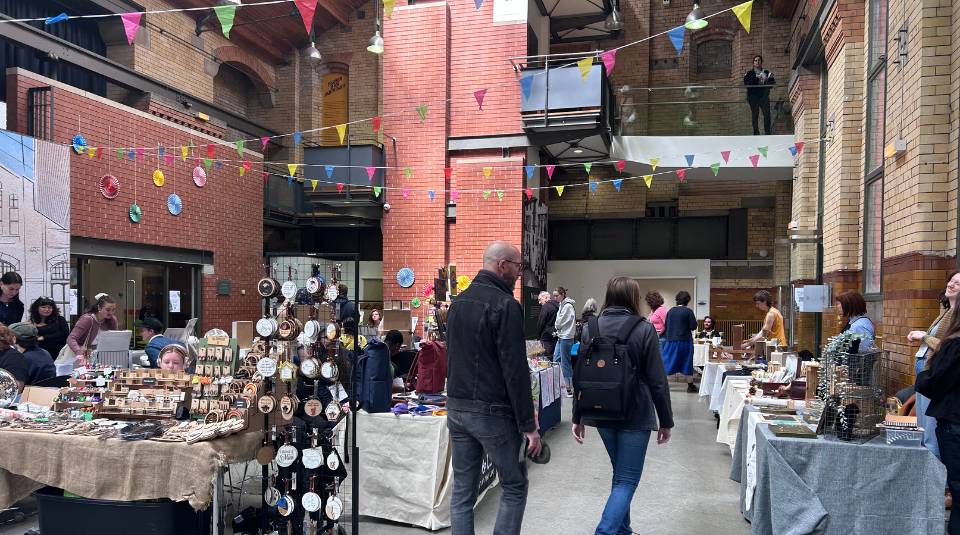 People's History Museum makers market people walking around