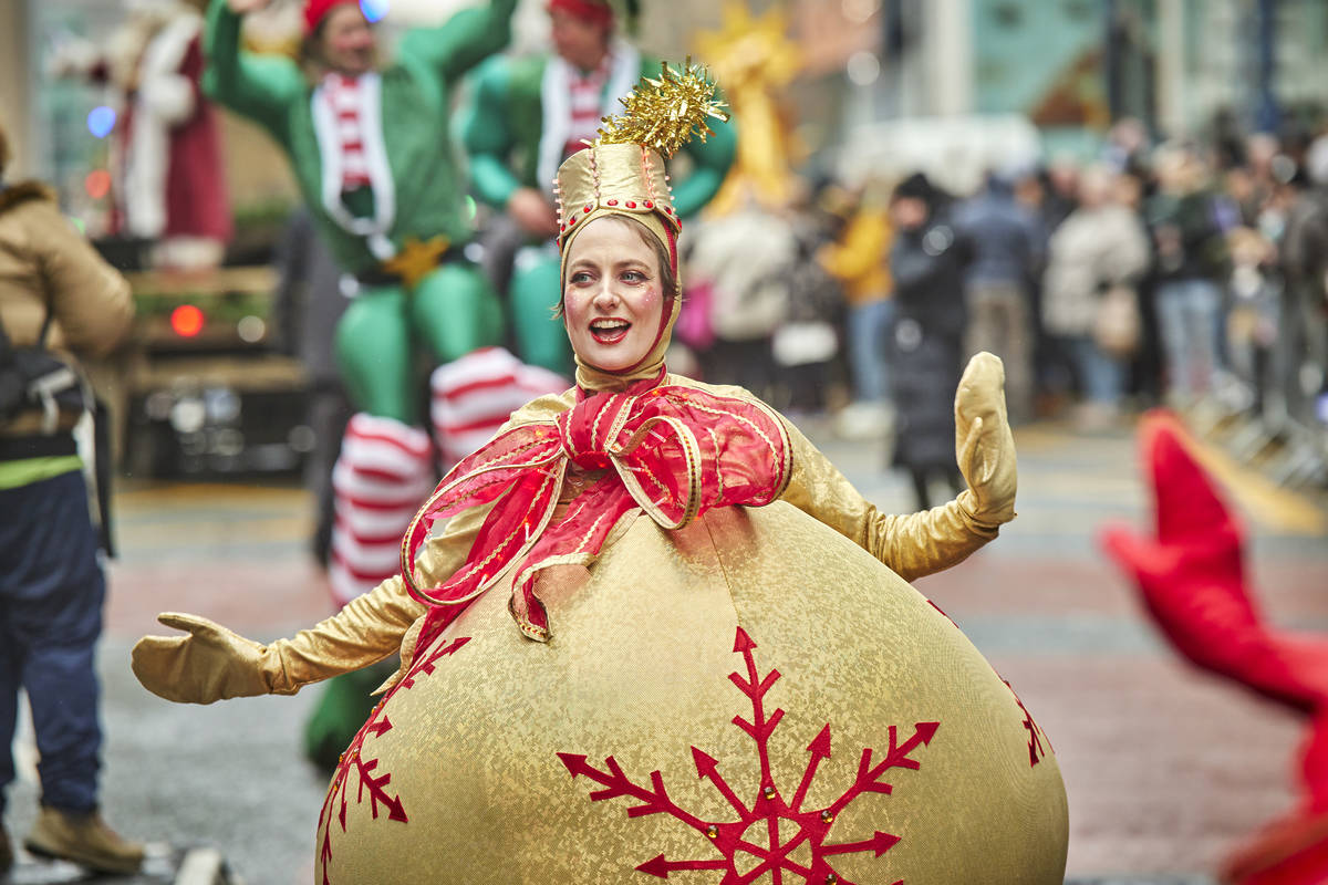 person dressed as bauble at manchester christmas parade