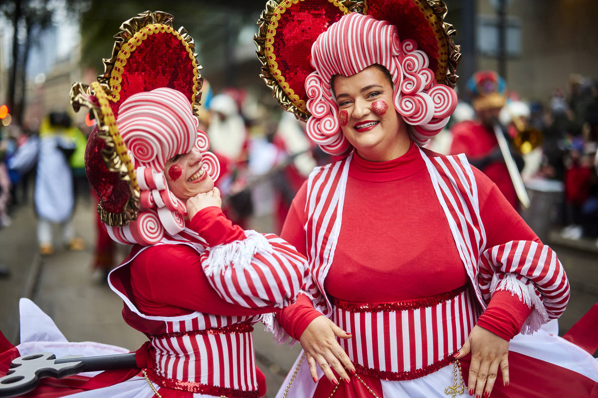 dancers with red and white costumes on in parade