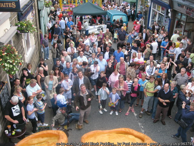 people gathered at world black pudding throwing championships in ramsbottom