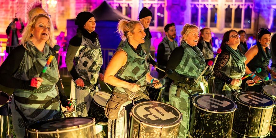 musicians banging drums
