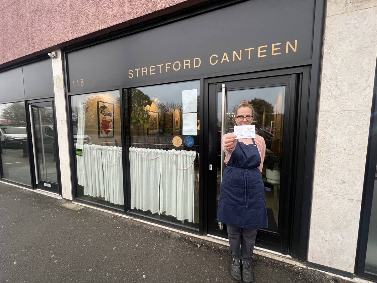 streetsmart label held up outside stretford canteen, stretford, greater manchester
