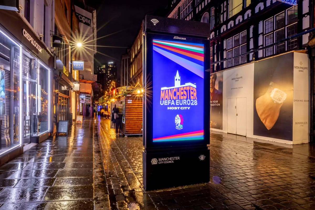digital screen lit up with manchester euro 2028 on king street