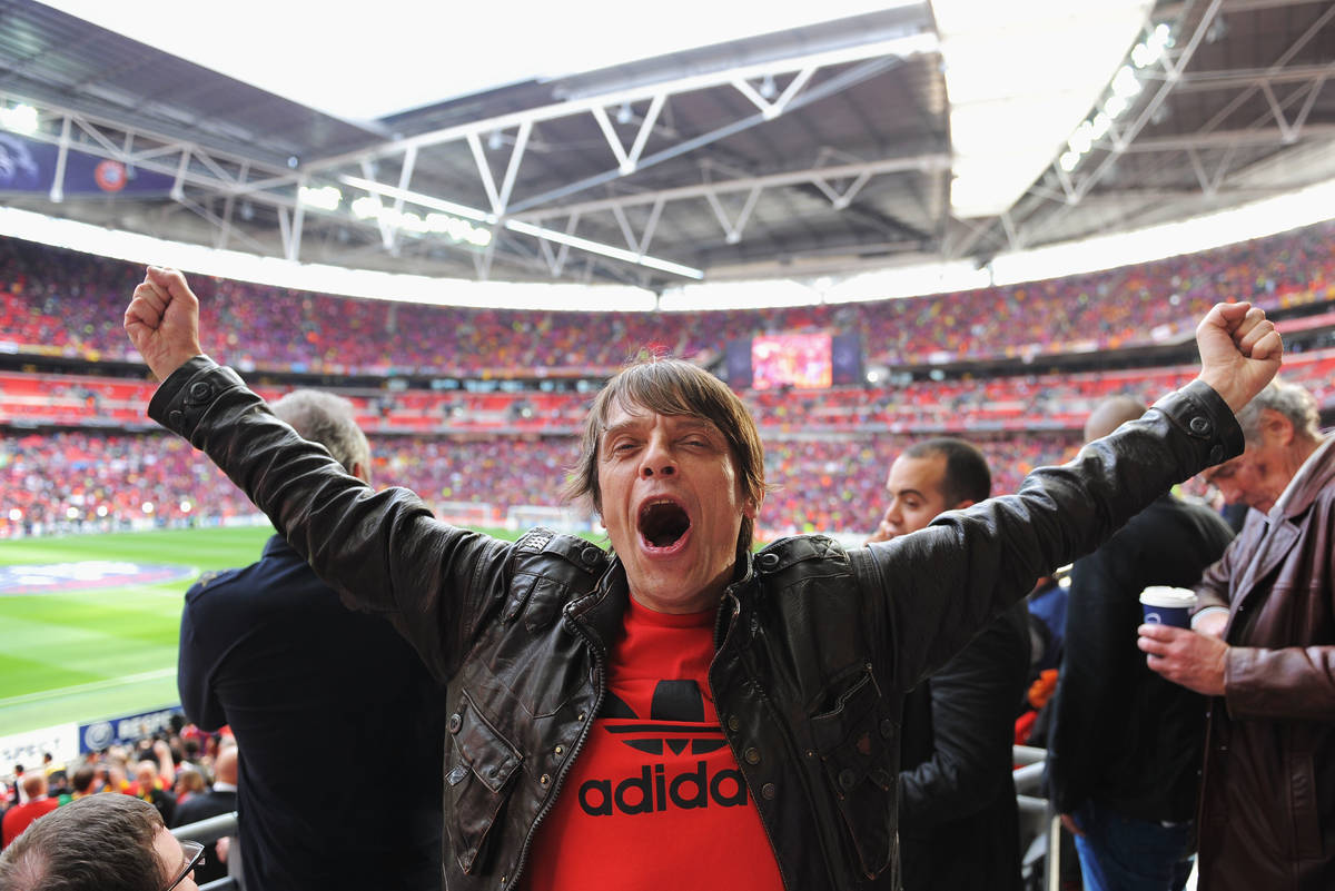Musician Gary 'Mani' Mounfield enjoys the atmosphere ahead of the UEFA Champions League final between FC Barcelona and Manchester United FC at Wembley Stadium on May 28, 2011 in London, England.