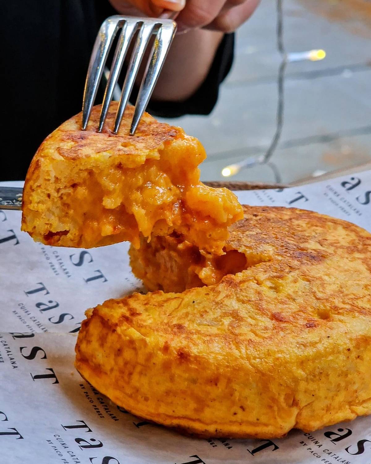 slice of spanish tortilla being taken