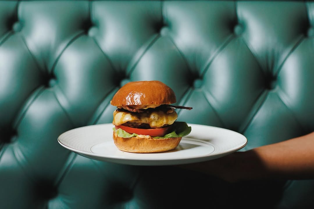 burger on plate at tender restaurant inside stock exchange hotel manchester