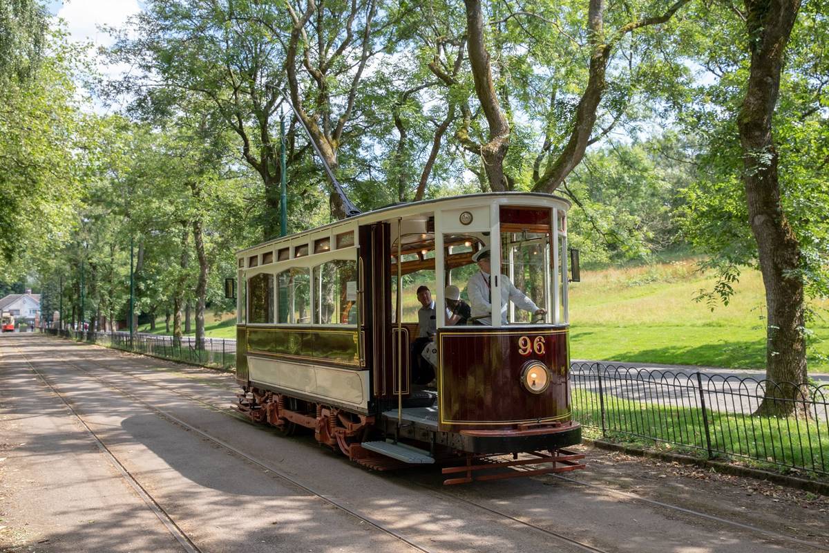 96 vintage brown tram going through heaton park