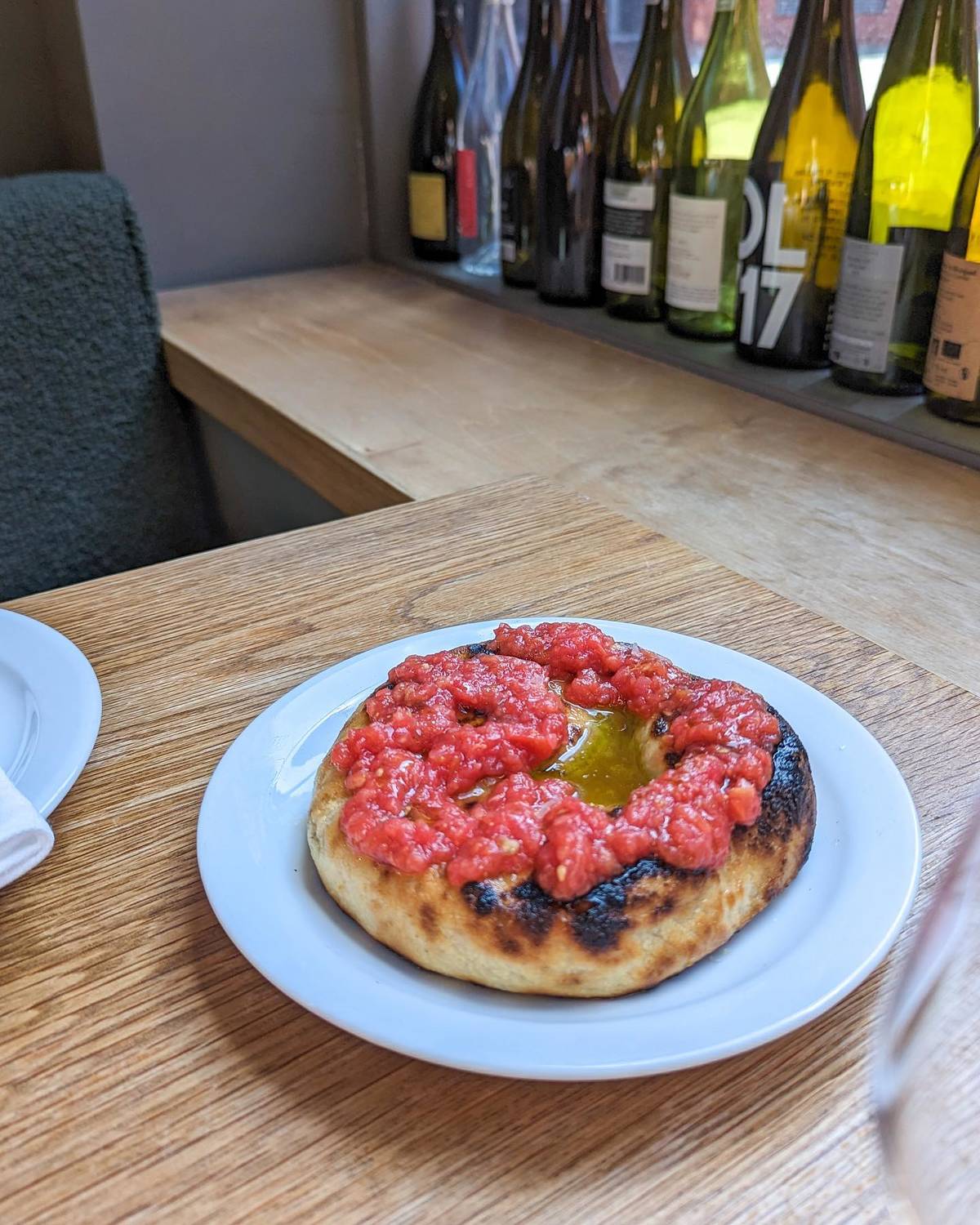 grilled flatbread topped with vesuvio tomato at erst