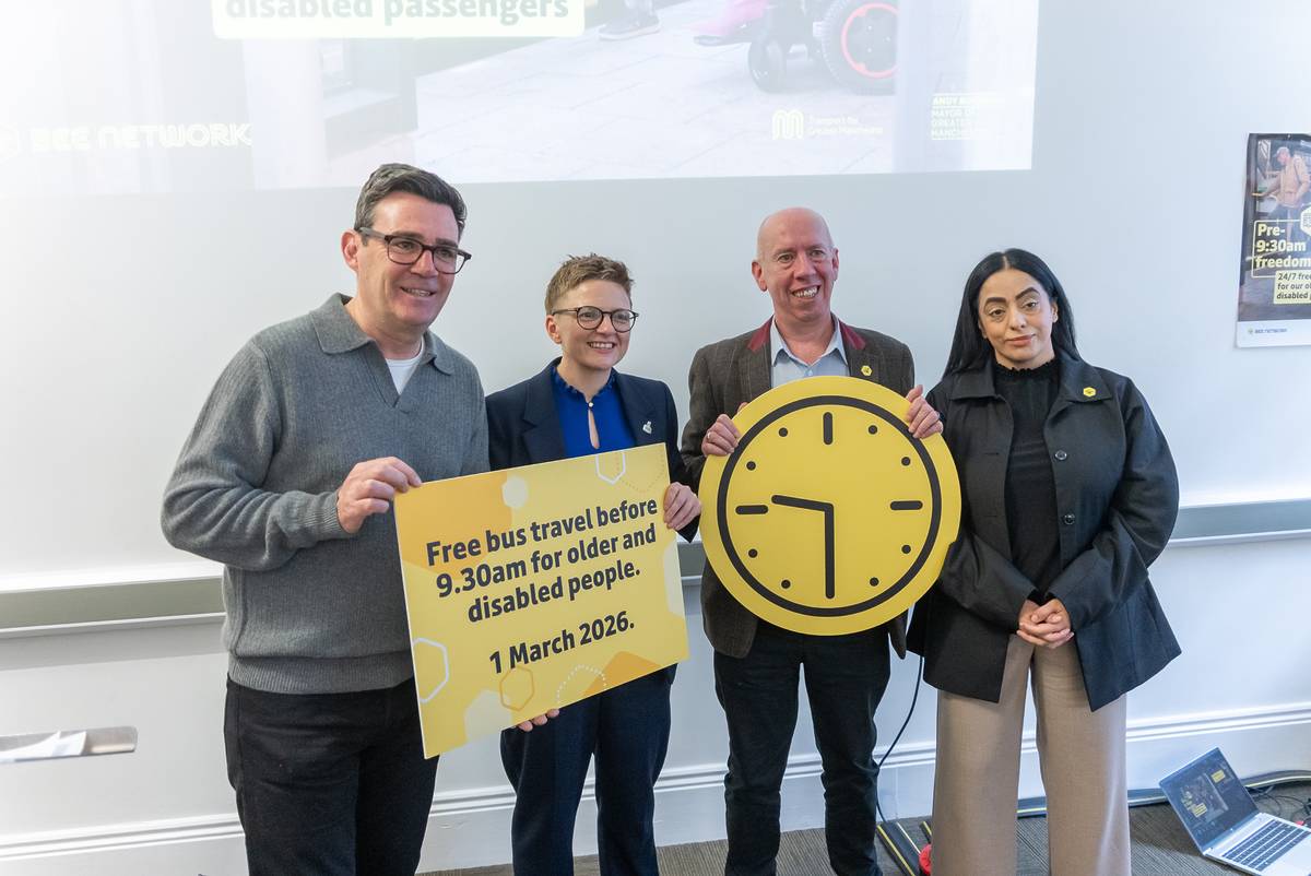 mayors and councillors stood with signs about 9am time restriction being lifted on greater manchester buses