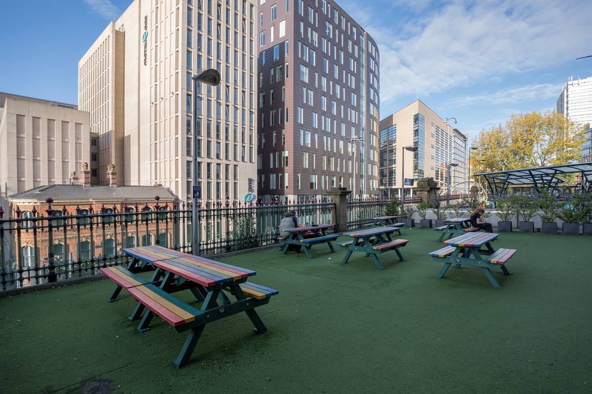 benches at piccadlly entrance before sanctuary garden