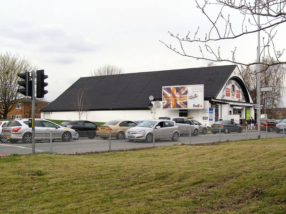 cars passing embassy club on rochdale road, manchester