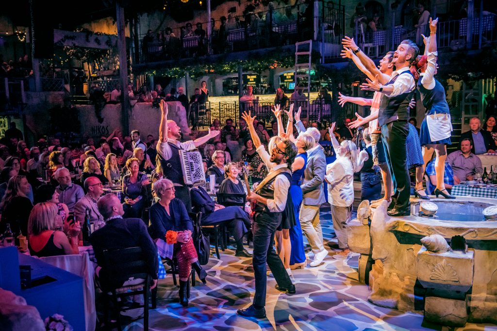 musicians and people dancing at mamma mia the party in london
