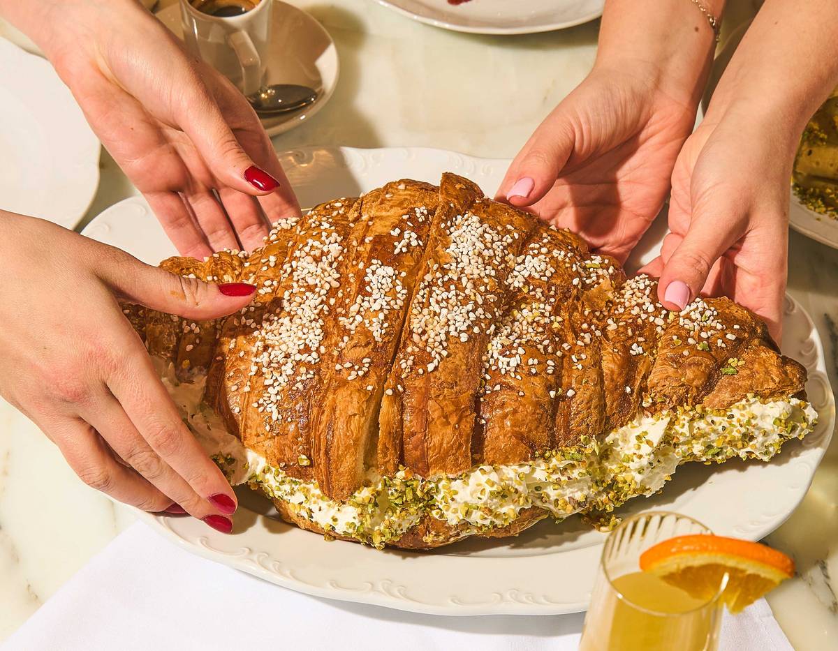 One of Manchester’s popular Italian restaurants has launched a giant, foot-long croissant filled with layers of pistachio cream or prosciutto di Parma – and it takes two people to finish it