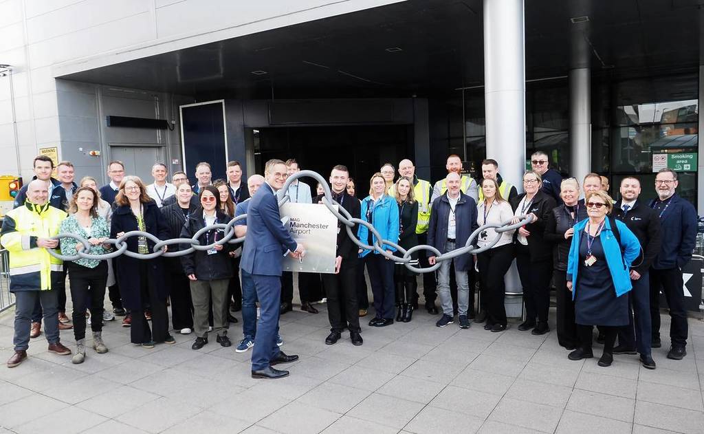Managing Director Chris Woodroofe marked the milestone of terminal 1 closure by wielding a ceremonial padlock
