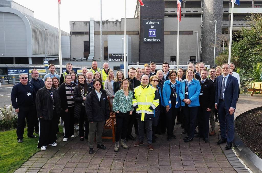 people stood outside terminal 3 at manchester airport