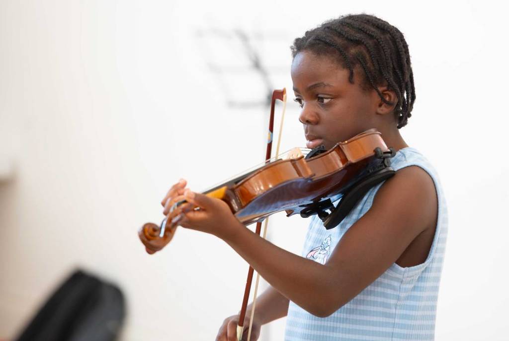 child playing violin olympias music foundation manchester arts grants