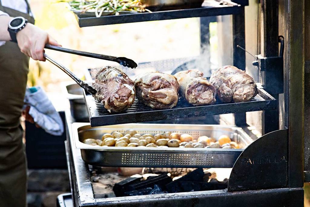 Cooking lunch at Our Farm over open fire